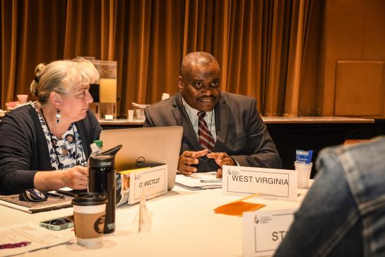 Man at table at conference